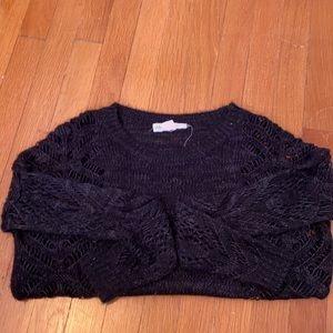 Black knit open design sweater
